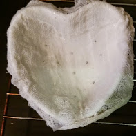 Lining the mold with cheesecloth makes it easy to unmold later.